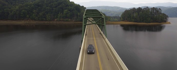 Bridge with car over water